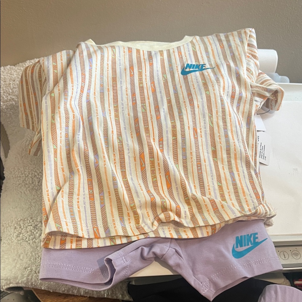 Nike Orange and Cream Striped Tee with Purple Shorts